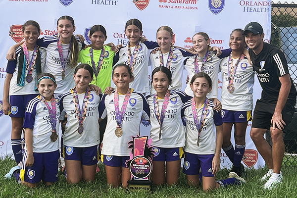 Keegan with 2013 Girls in tournament victory photo
